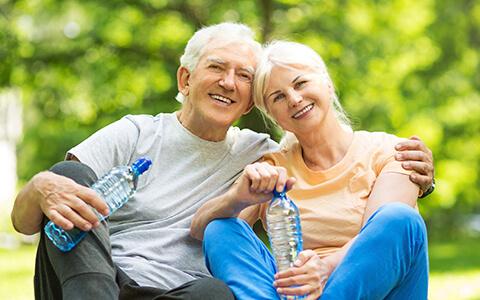 Elderly couple resting after exercise 